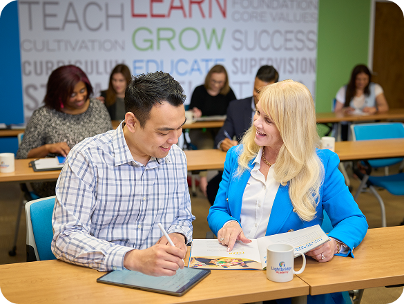 Lightbridge Academy CEO Gigi Schweikert speaking with a franchisee.