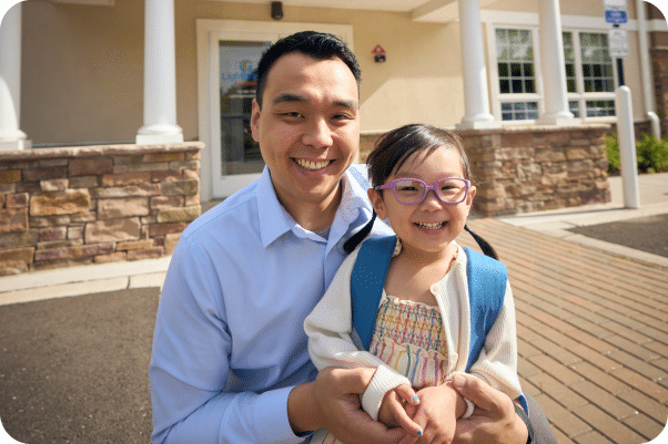 A father and daughter outside of a Lightbridge Academy.
